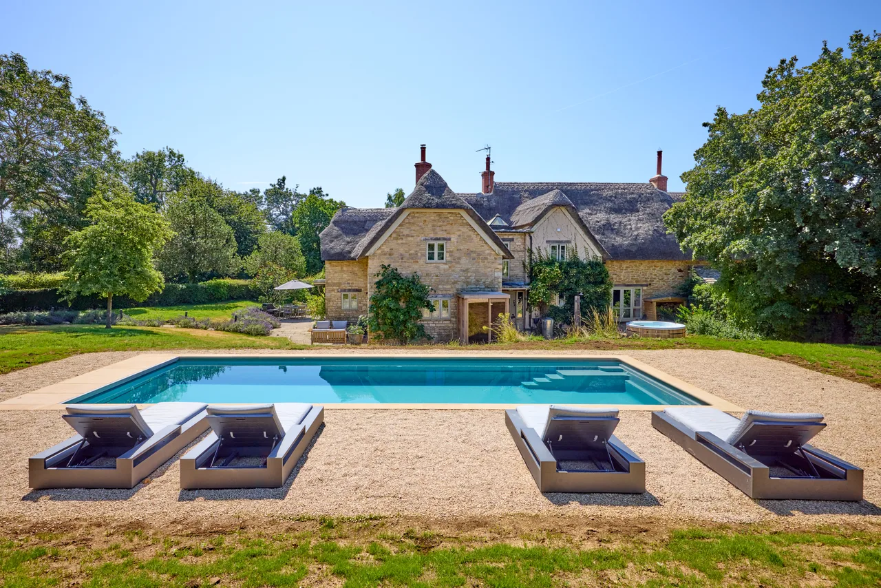 Heated outdoor pool in front of Brandy's Farmhouse